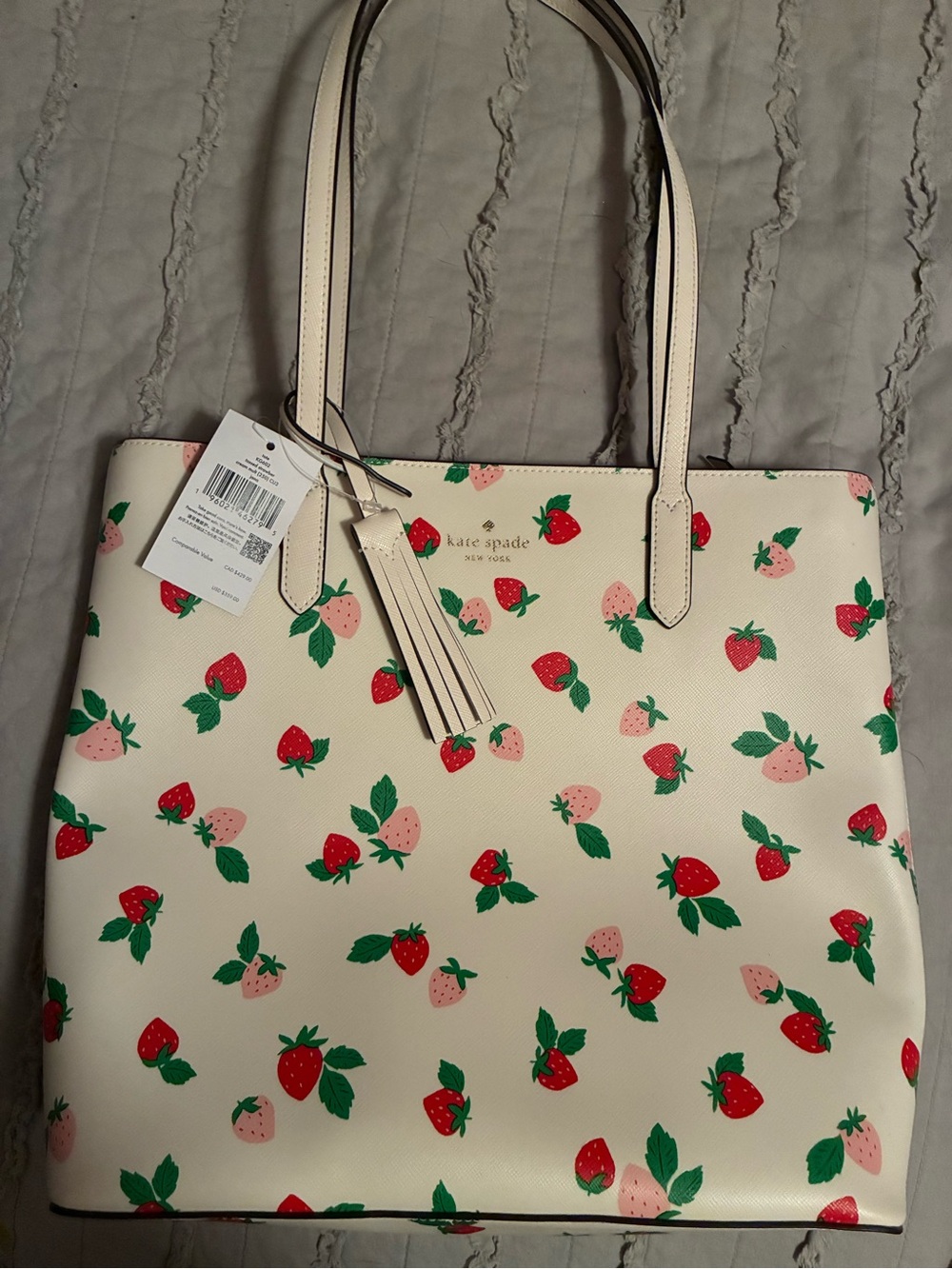 kate spade cream tote with red and pink strawberry print